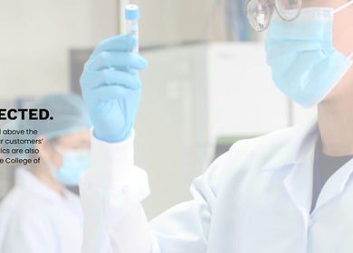 Lab technician in SGD Pasig, Metro Manila, PH, wearing safety gear performs precise diagnostics.