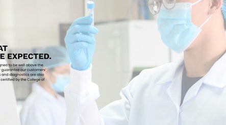 Lab technician in SGD Pasig, Metro Manila, PH, wearing safety gear performs precise diagnostics.