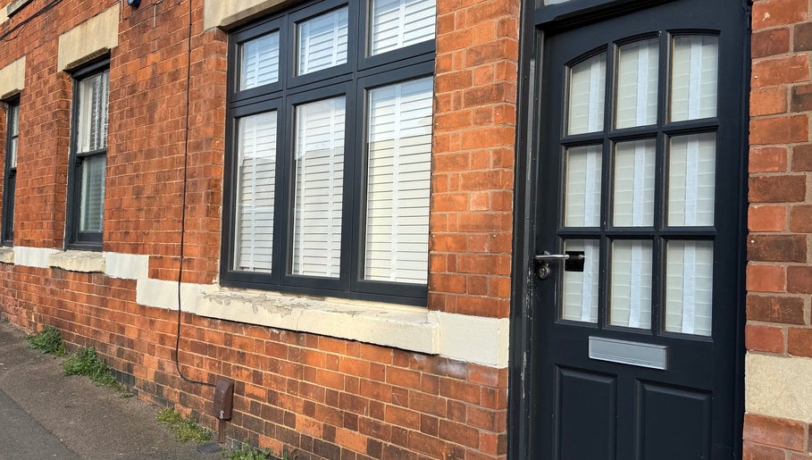 Entrance of Beauty Haven with rustic brick facade at Rothwell, England, GB.