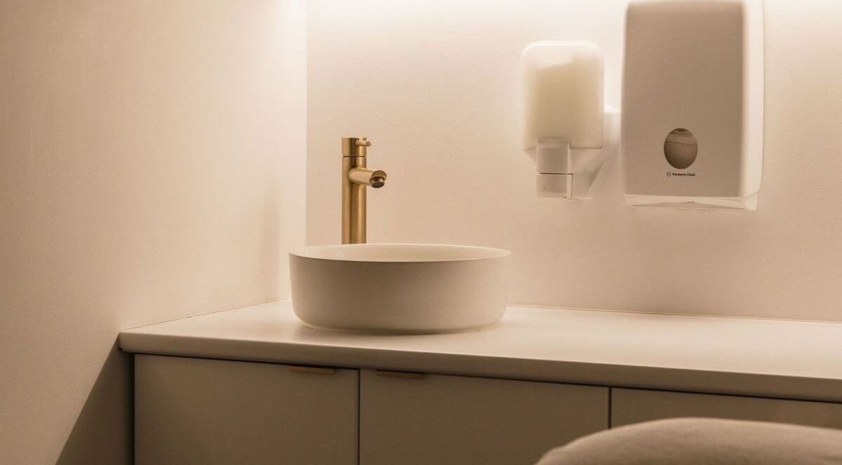 Elegant washbasin and gold tap at Blank Slate Laser, Liverpool, New South Wales, AU.