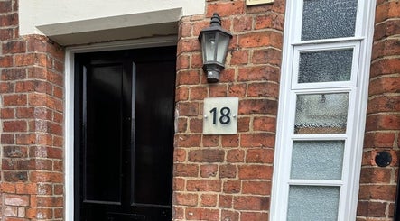 Welcoming entrance of Nails by Stacey, Newcastle-under-lyme, England featuring a classic brick facade.