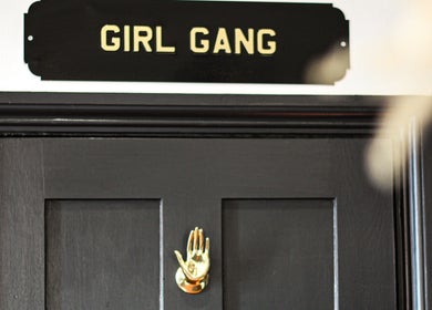 Stylish door with 'Girl Gang' sign at Nails by Stacey, Newcastle-under-Lyme, England, GB.