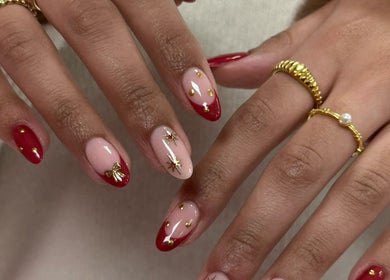 Elegant red and pink nail art with gold details at Nails by Stacey, Newcastle-under-lyme, England, GB.