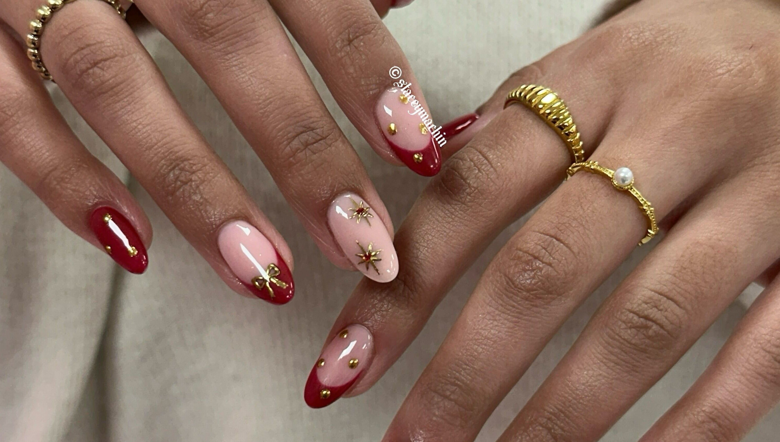 Stylish red and gold nail art at Nails by Stacey, Newcastle-under-lyme, England, GB.