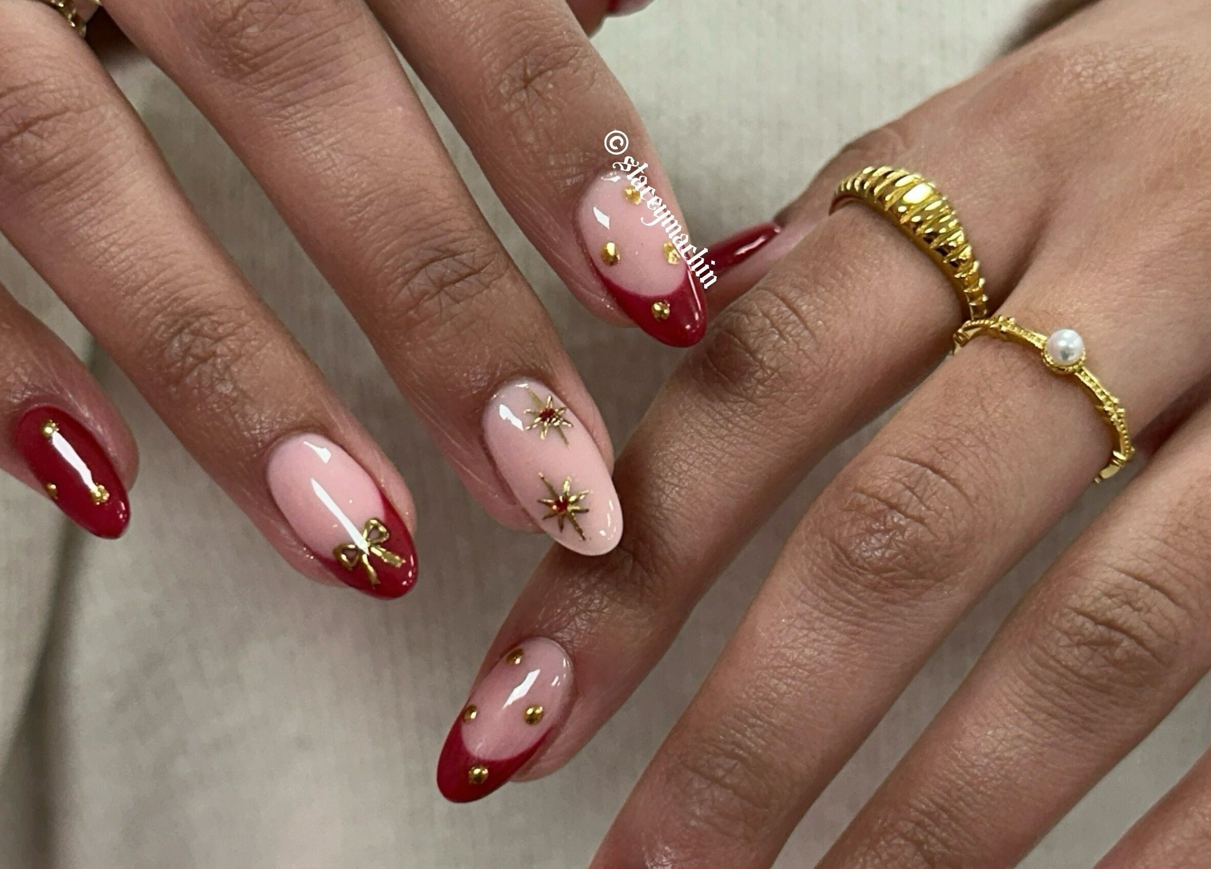 Stylish red and gold nail art at Nails by Stacey, Newcastle-under-lyme, England, GB.