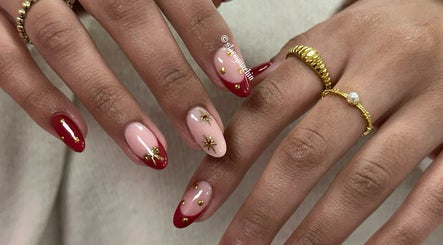 Stylish red and gold nail art at Nails by Stacey, Newcastle-under-lyme, England, GB.