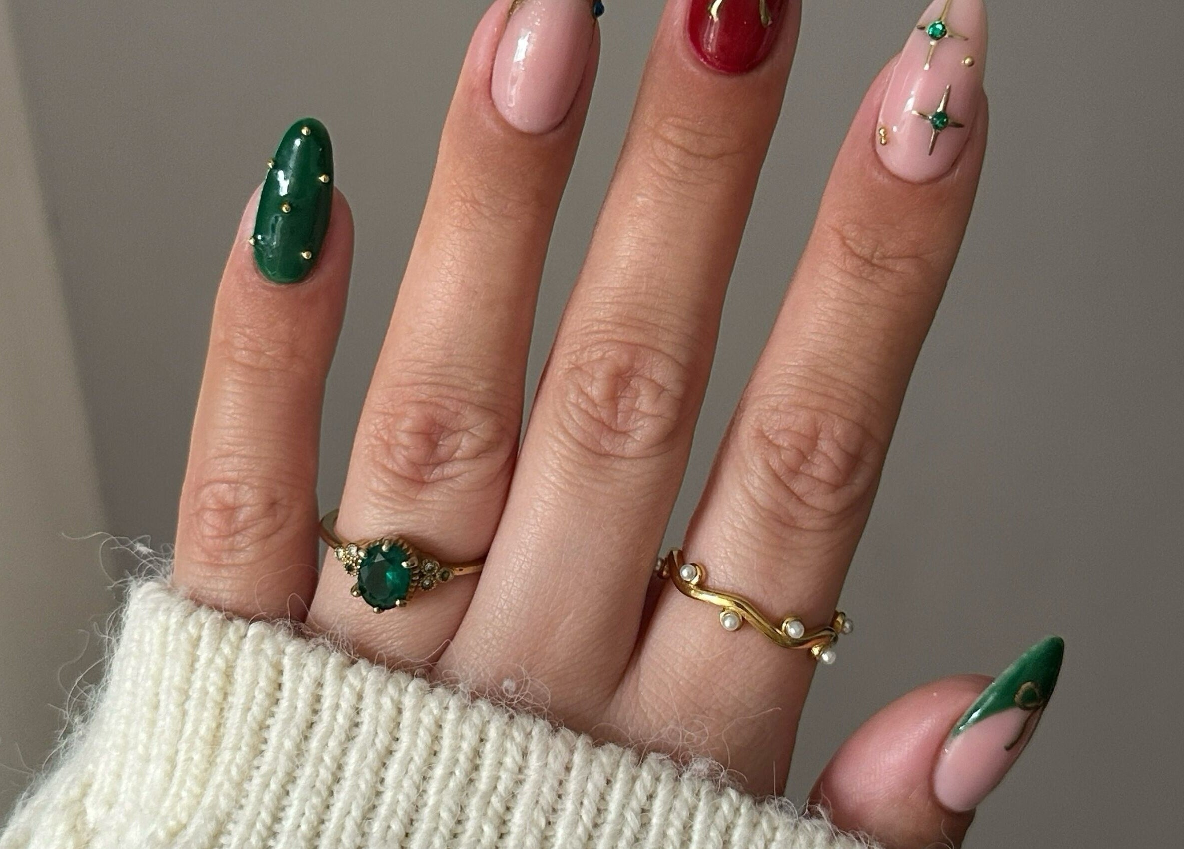 Elegant nail art at Nails by Stacey, Newcastle-under-lyme, England. Green and pink designs with gold accents.