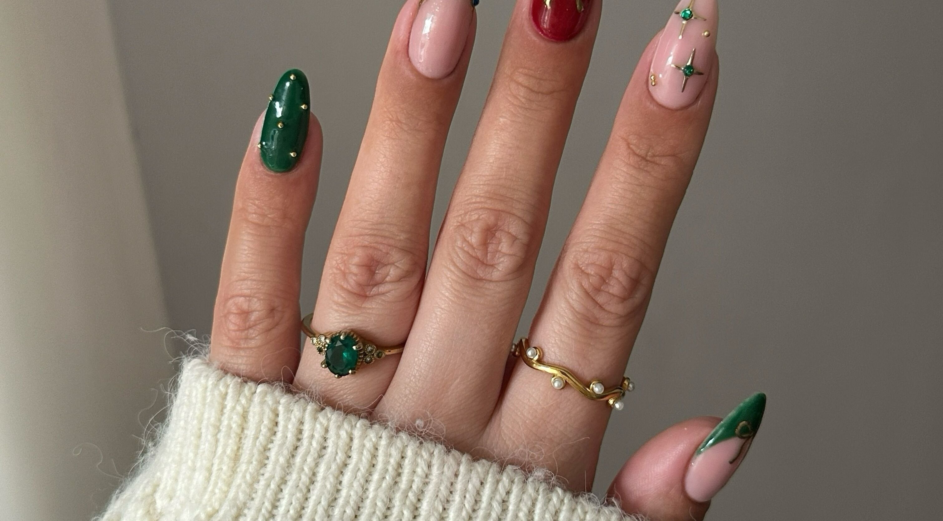 Elegant nail art at Nails by Stacey, Newcastle-under-lyme, England. Green and pink designs with gold accents.