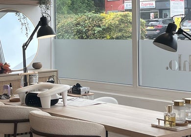 Elegant nail station at Katejnails, Whitefield, England, GB, with a stylish mirror and natural decor.