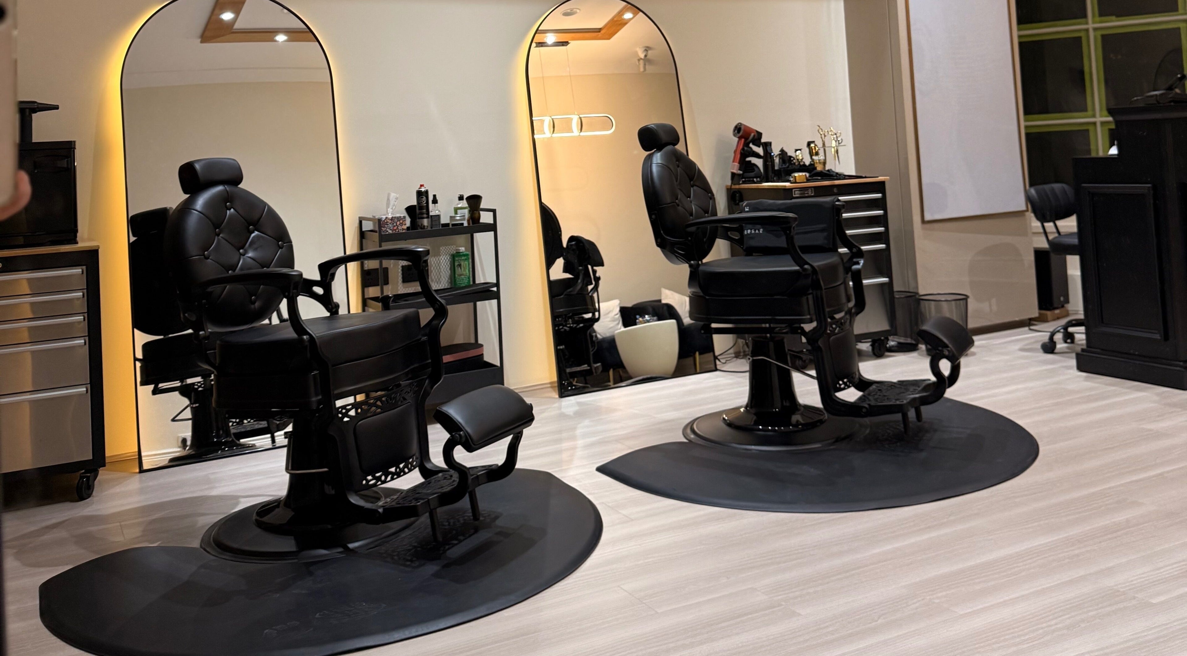 Modern barber chairs at House of Handsome Barbershop in Pyrmont, New South Wales, AU.