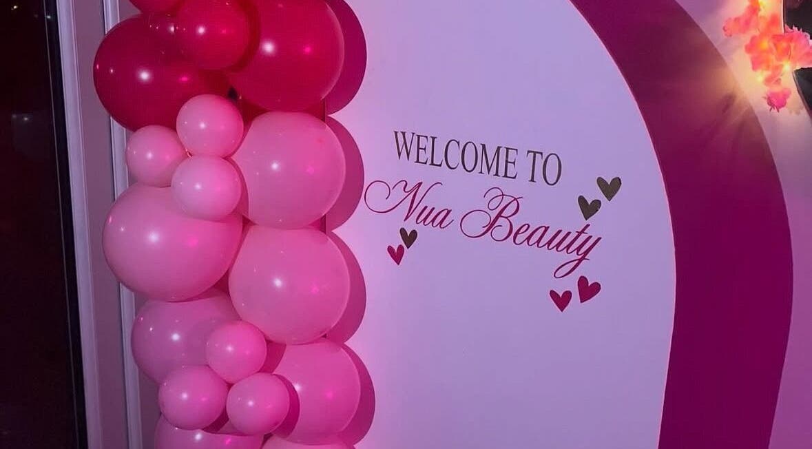 Welcome display with pink balloons at Nua Beauty, Bradford, England, GB.