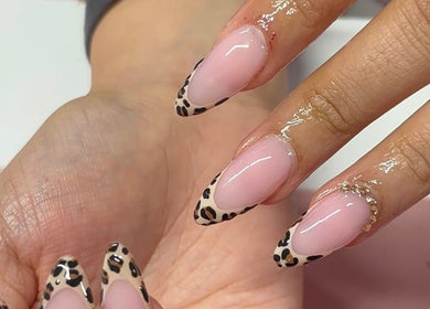 Stylish leopard print nail art at Nua Nails, Bradford, England, GB. Chic and trendy nail designs.
