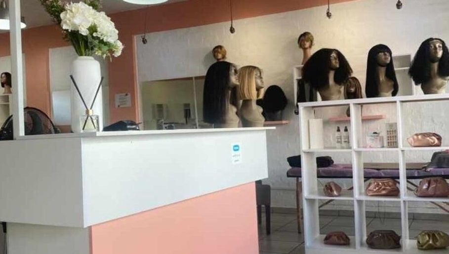 The Belle Boutique in Randburg, Gauteng, ZA showcasing stylish wig displays and chic interior decor.