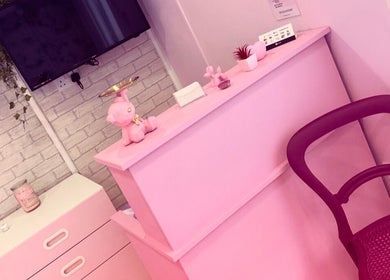 Chic pink reception at Braided Boutique, Spalding, England, GB, with modern decor and vibrant accents.