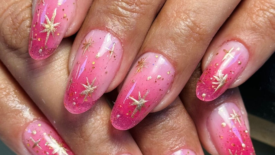 Pink nails with gold stars at Arise Beauty by Catalina Popa in Huddersfield, England, GB.