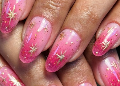 Pink nails with gold stars at Arise Beauty by Catalina Popa in Huddersfield, England, GB.