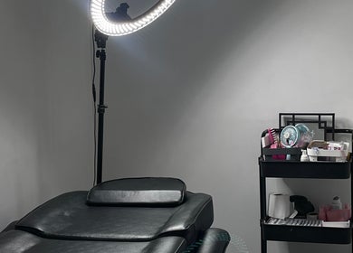 Relaxing treatment room at Jlashparlour in Dagenham, England, GB with a professional setup for beauty services.