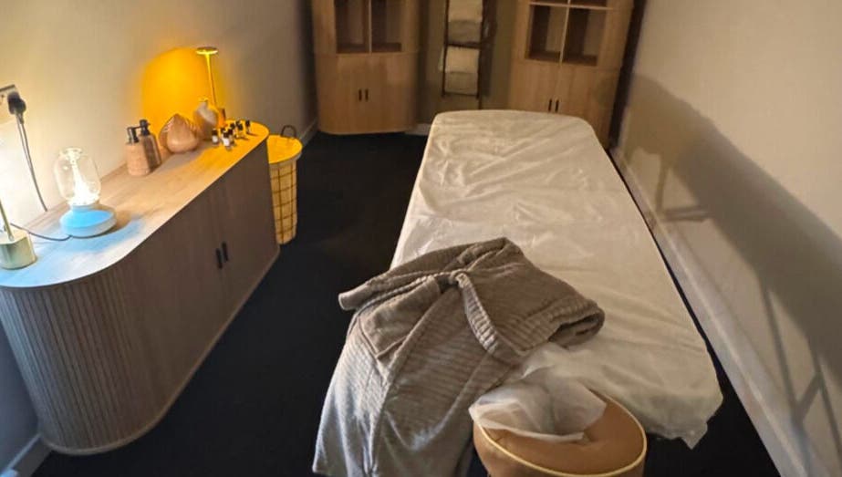 Relaxing treatment room at Clear Canvas Tattoo Removal, Peterhead, Scotland, GB, with cozy decor and ambient lighting.