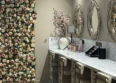 Luxurious beauty station at Amy Nicole, Neath, Wales, GB, adorned with a stunning floral wall decor.