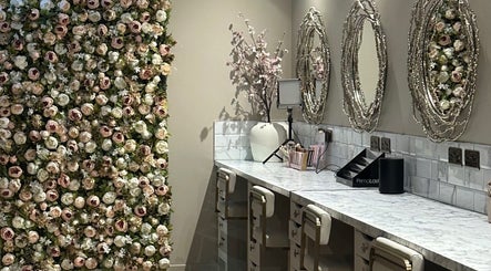 Luxurious beauty station at Amy Nicole, Neath, Wales, GB, adorned with a stunning floral wall decor.