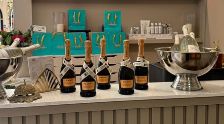 Elegant display of champagne bottles at Amy Nicole, Neath, Wales, GB, creating a luxurious ambiance.