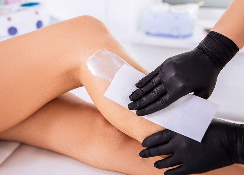Leg waxing treatment at NUDE, London, England, GB highlighting expert care and smooth results.