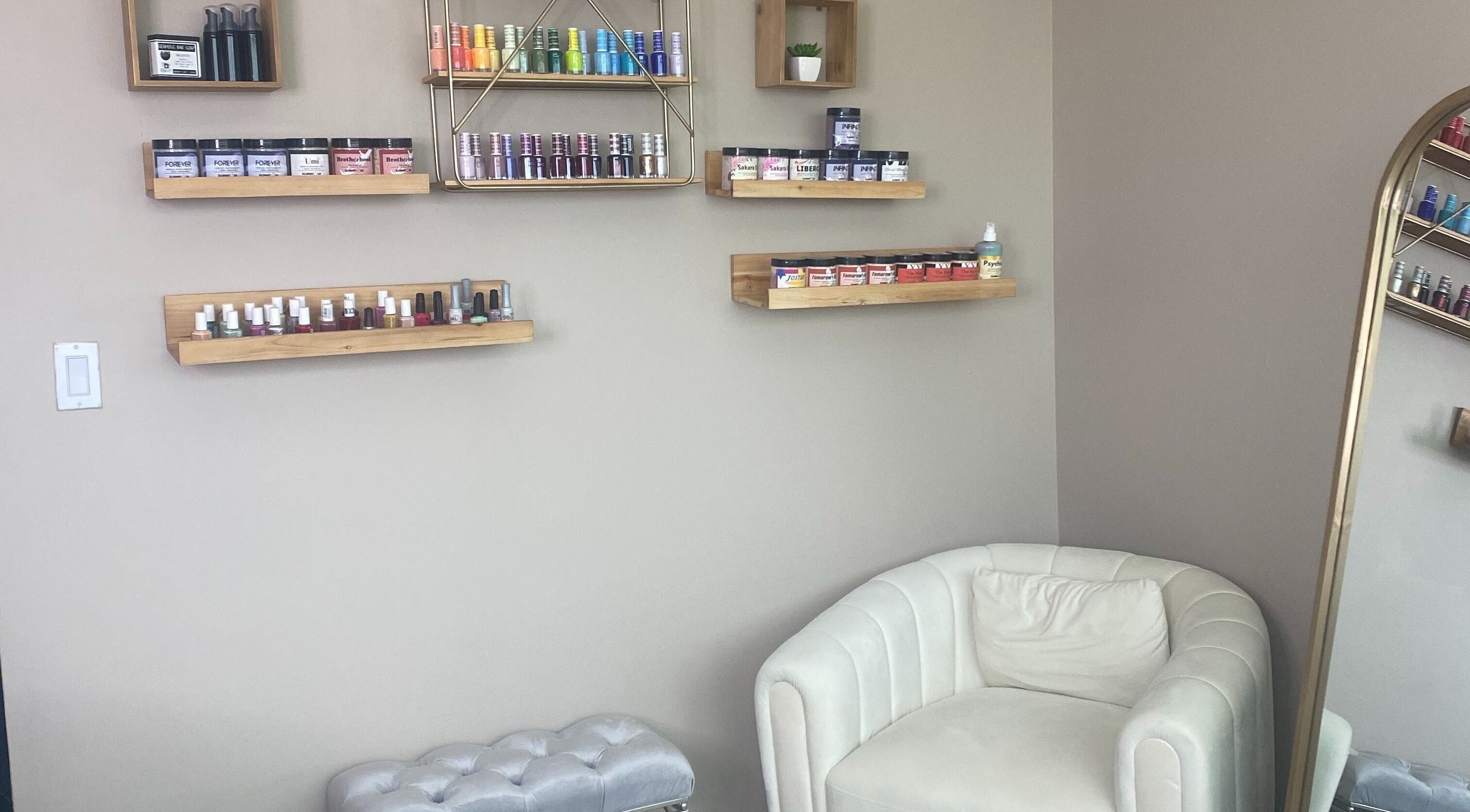 Shelves with beauty products and a plush chair at Hidden Gem, Rockdale, Texas, US.