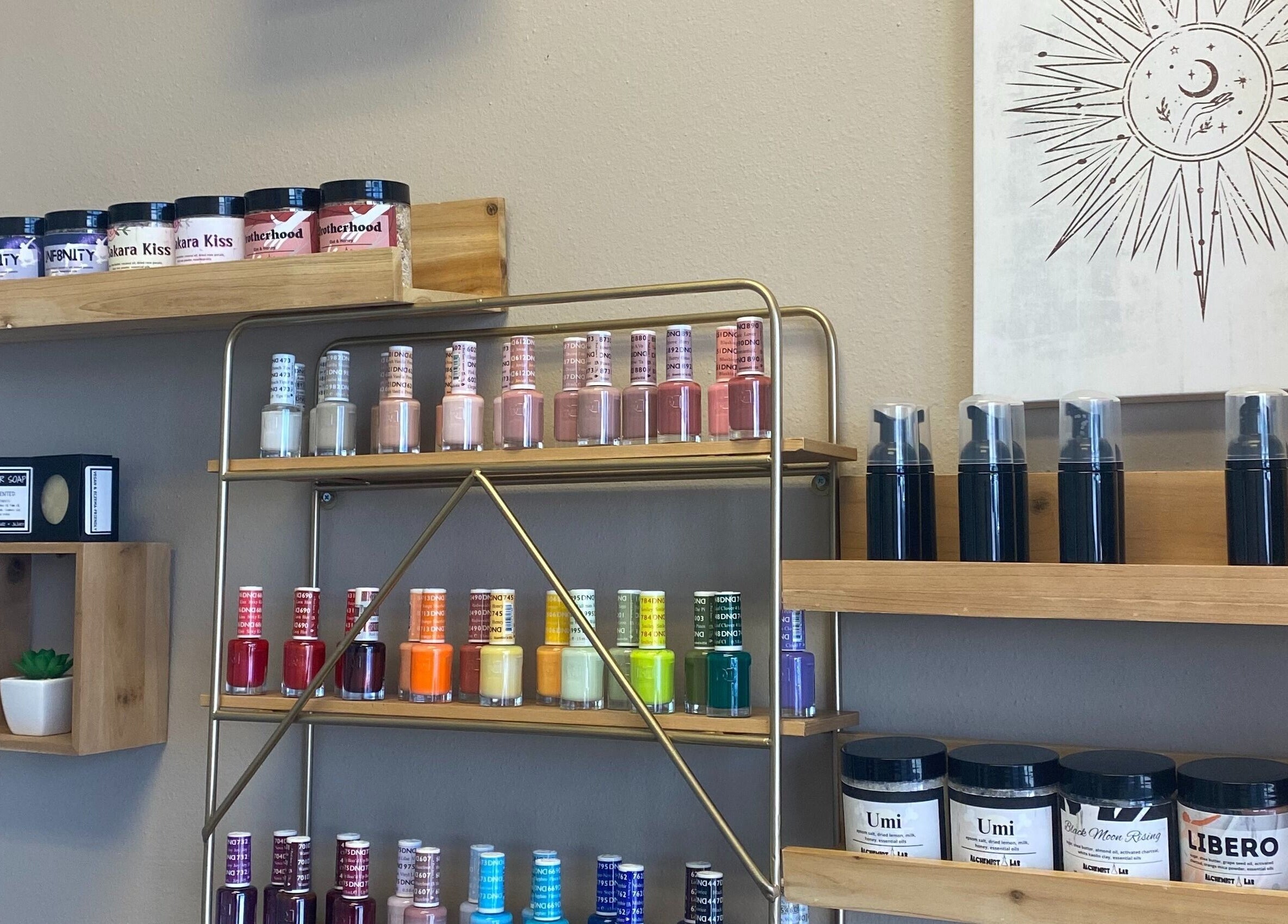 Nail polish display at Hidden Gem, Rockdale, Texas, US, showcasing beauty products and art.
