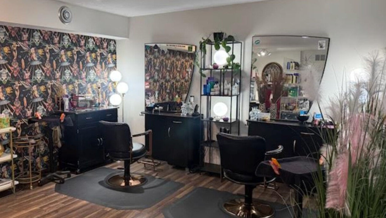 Stylish salon chairs and mirrors at Rock N Rollerz Salon, Minneapolis, Minnesota, US.