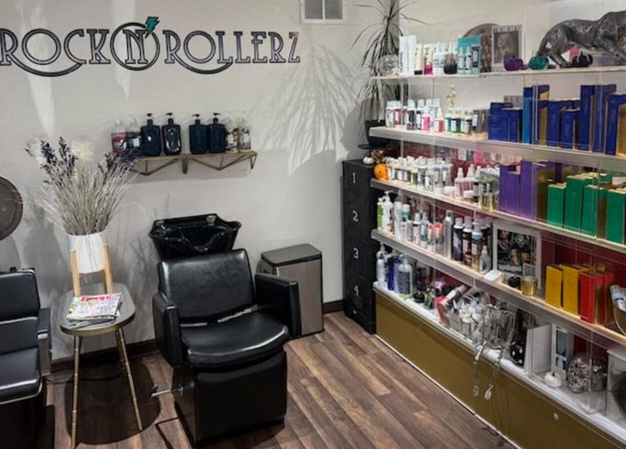 Rock N Rollerz Salon interior in Minneapolis, Minnesota, with sleek chairs and shelves of beauty products.
