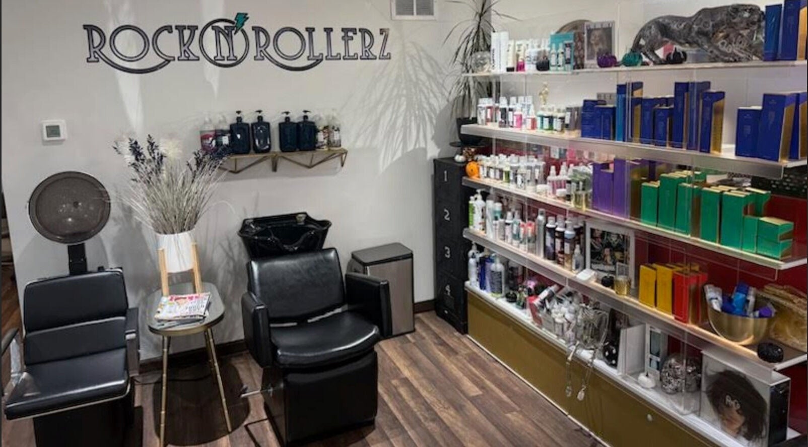 Rock N Rollerz Salon interior in Minneapolis, Minnesota, with sleek chairs and shelves of beauty products.