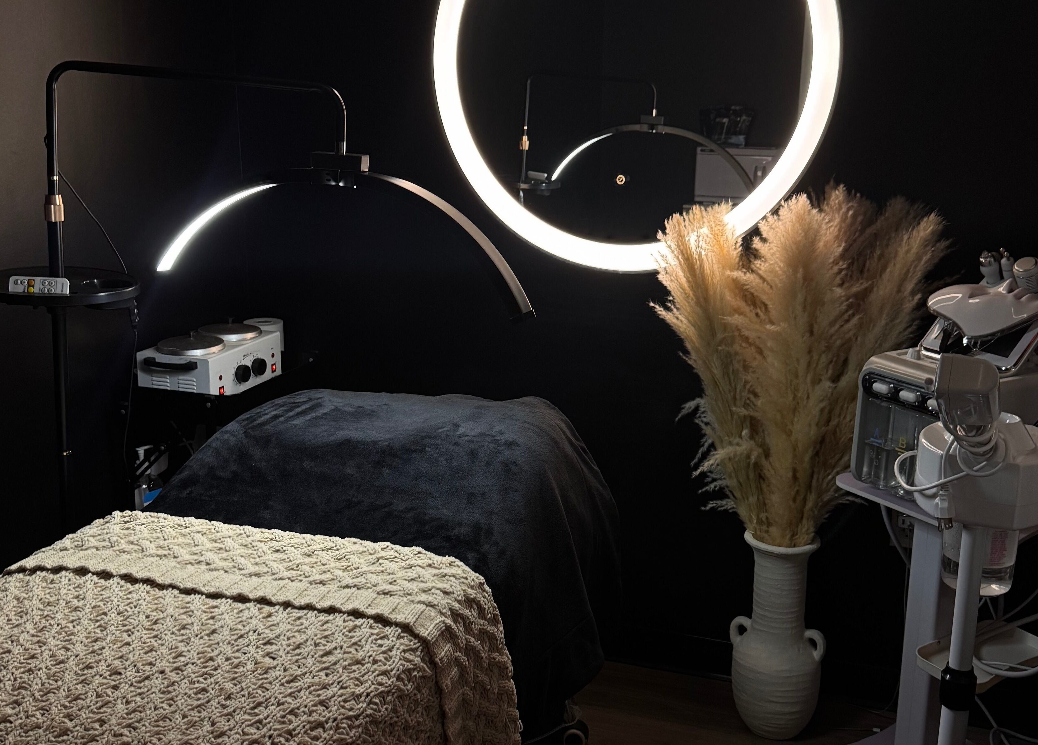 Elegant beauty room at Gloomskin Studio, Texas, Texas, US with ambient lighting and modern skincare equipment.