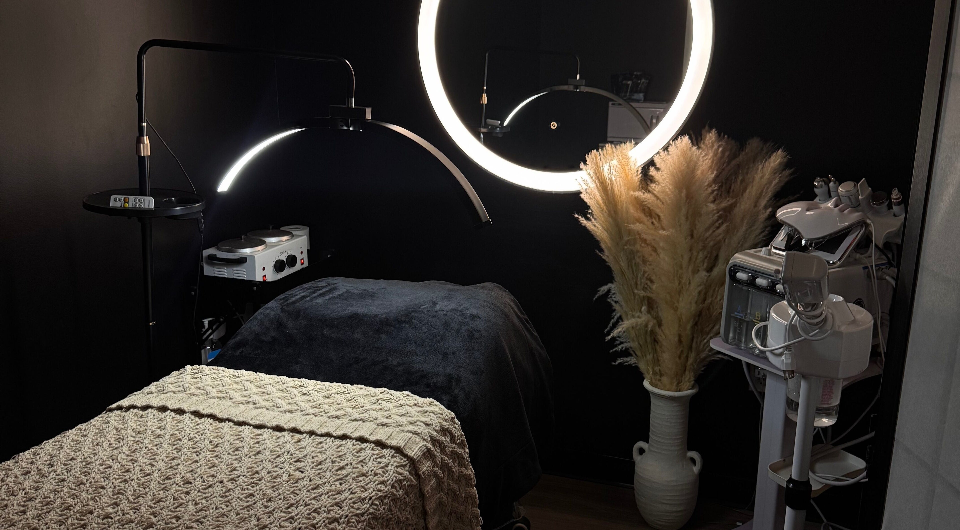 Elegant beauty room at Gloomskin Studio, Texas, Texas, US with ambient lighting and modern skincare equipment.