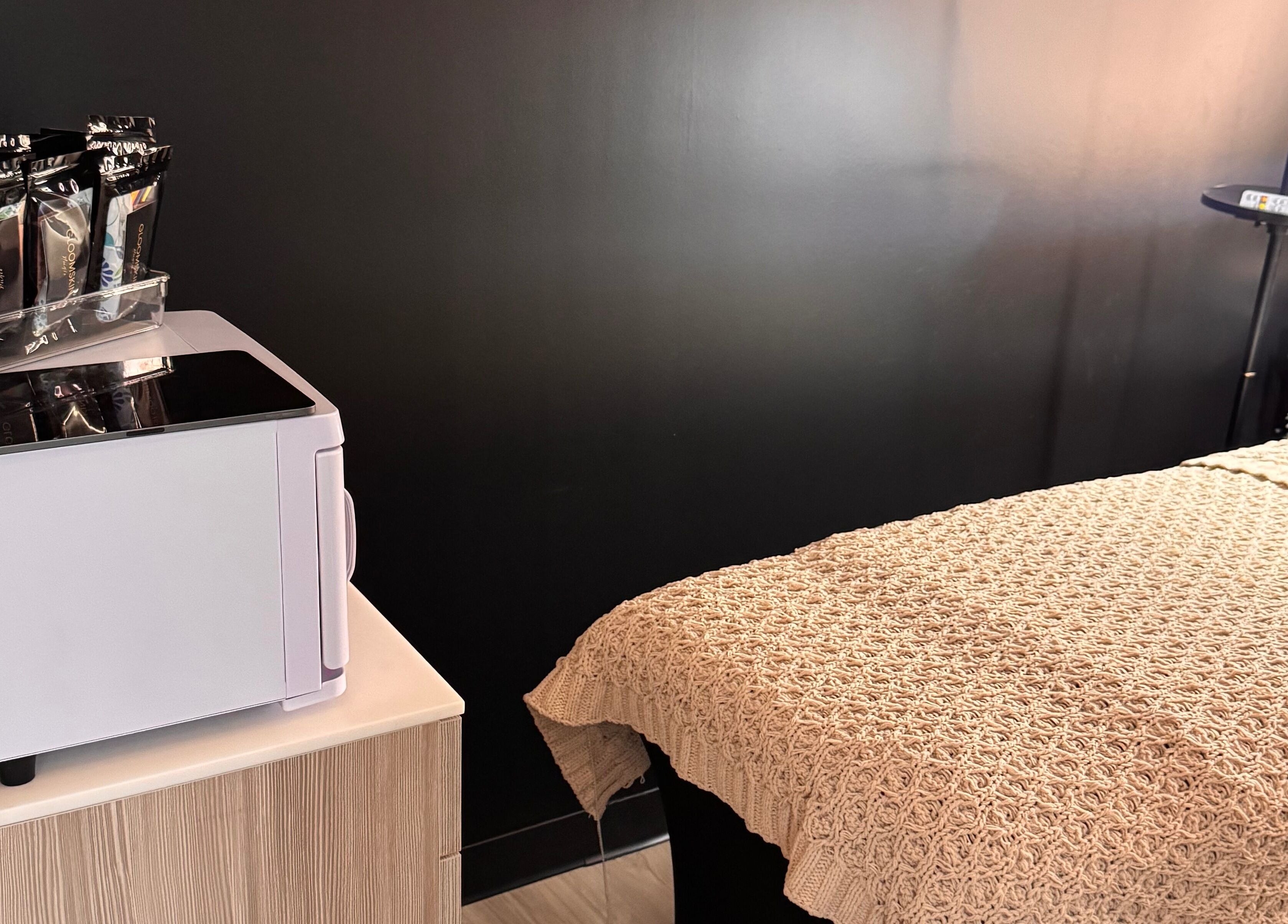 Cozy bed and modern equipment in Gloomskin Studio, Texas, Texas, US. A perfect setting for relaxation.