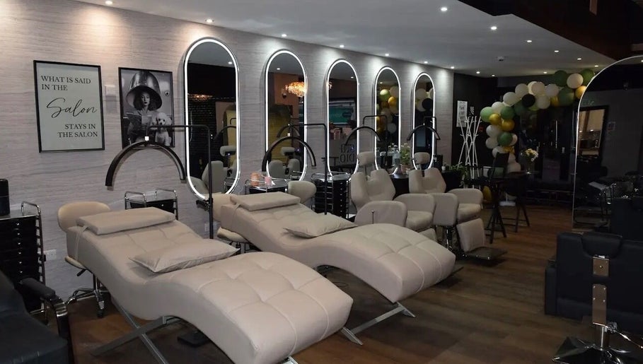 Luxurious salon interior at Claws By Jess, Bournemouth, England, GB with plush chairs and stylish decor.