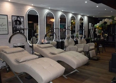 Luxurious salon interior at Claws By Jess, Bournemouth, England, GB with plush chairs and stylish decor.