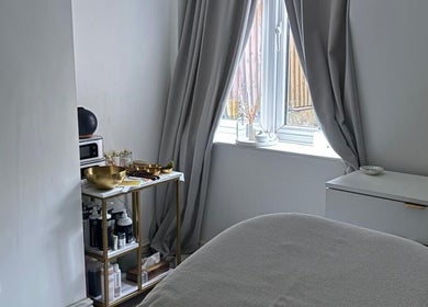 Serene treatment room at Hana’s Brow Bar, London, England, GB, featuring elegant decor and soft lighting.