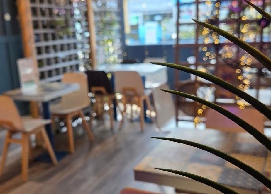 Warm, inviting seating area at Lisa at Hubxx Salon, Dunmurry, Northern Ireland, GB.