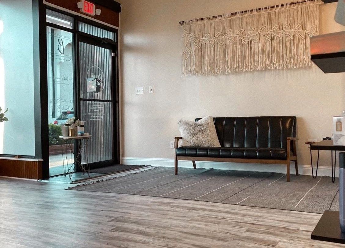 Chic reception area at Skin By Macie, Murray, Kentucky with modern decor and cozy seating.