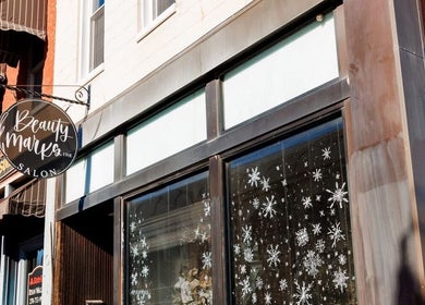 Front view of Skin By Macie, featuring a stylish exterior with snowflake decorations in Murray, Kentucky, US.