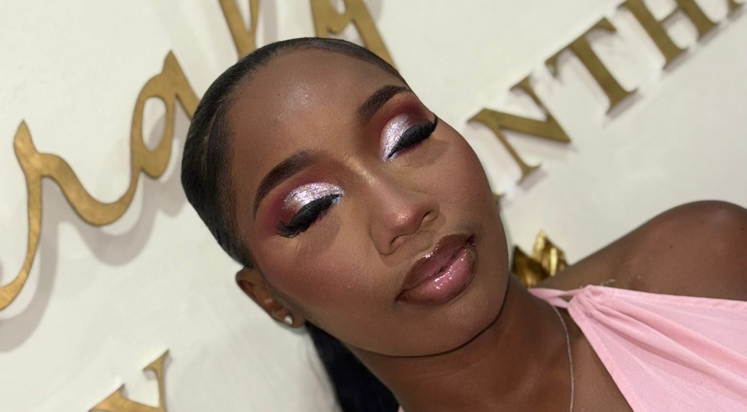 Elegant makeup at Emerald Empire in Willemstad, Curaçao, CW, showcasing bold eyeshadow and glossy lips.