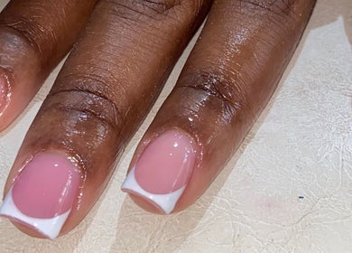 Beautiful French tip manicure at Paity’s Nails, Portmore, St. Catherine Parish, JM. Perfectly polished nails.