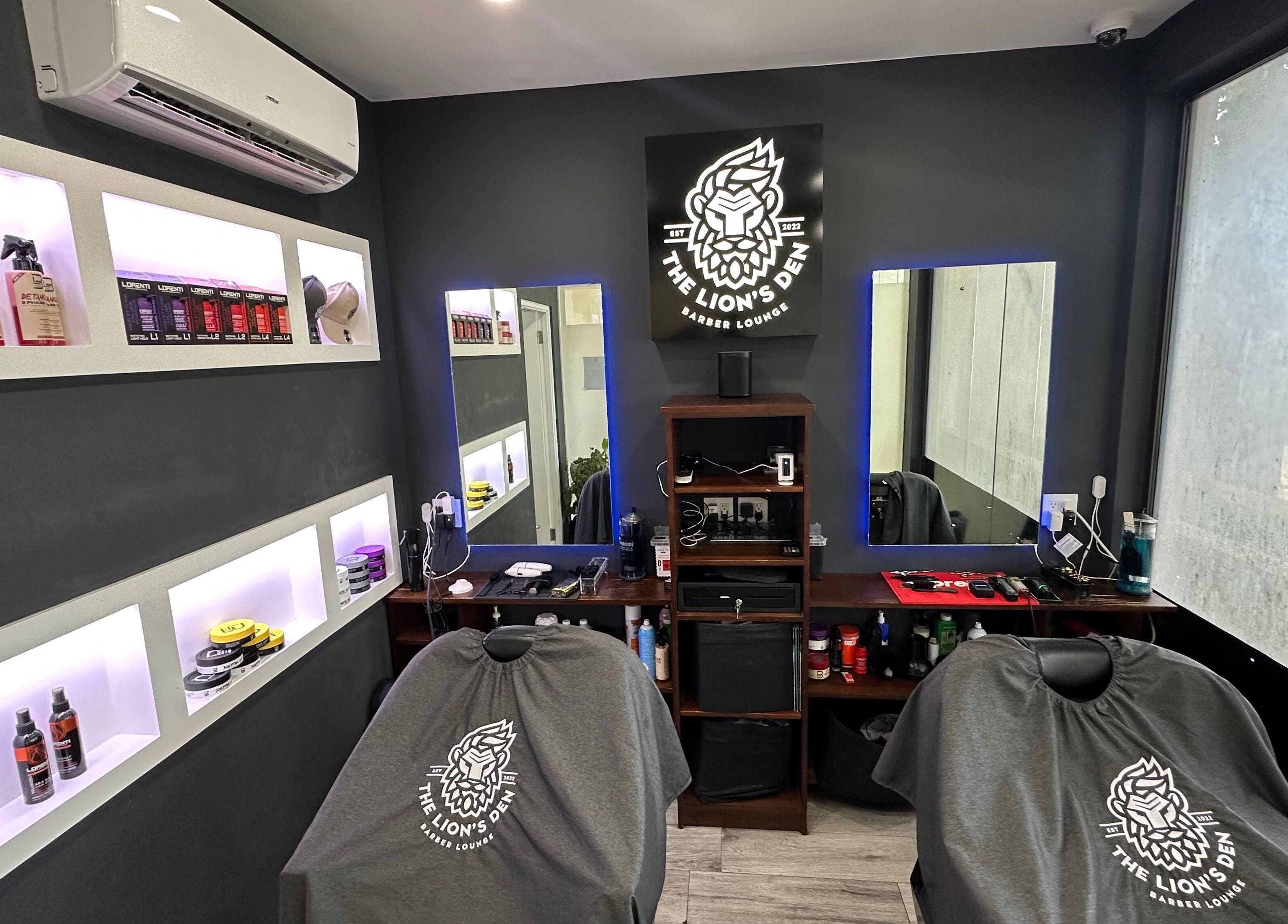 Chic interior of The Lion's Den Barber Lounge in Holetown, Saint James, BB with modern decor and grooming products.