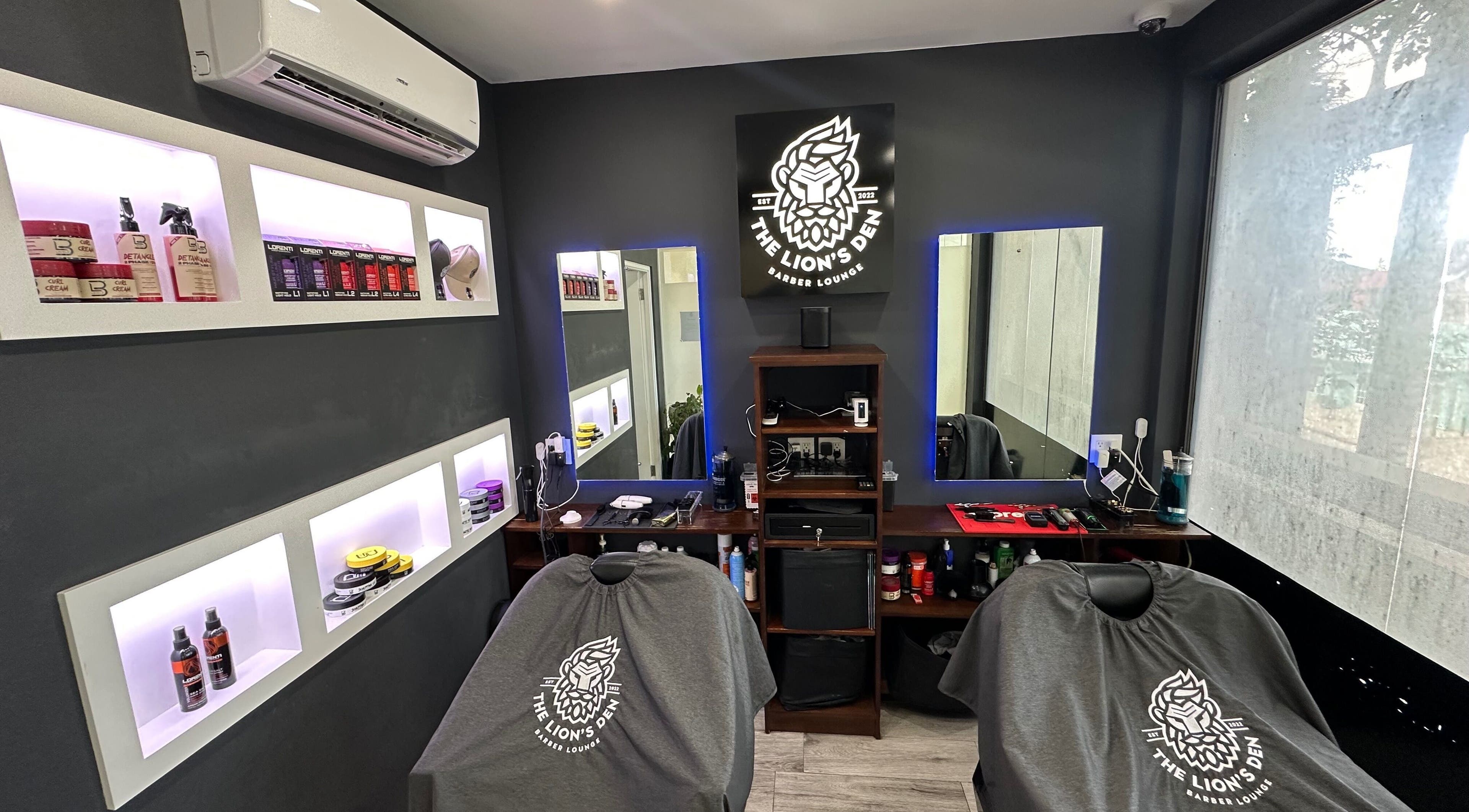 Chic interior of The Lion's Den Barber Lounge in Holetown, Saint James, BB with modern decor and grooming products.