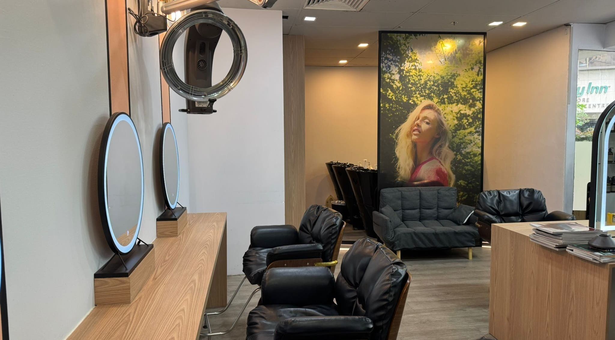 Chic interior of Focus Hairdressing in Singapore, Singapore, SG featuring stylish seating and mirrors.