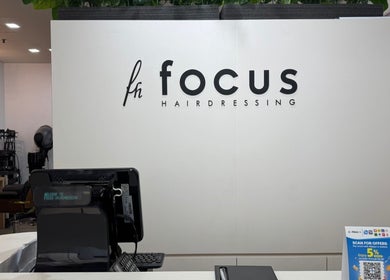 Reception area at Focus Hairdressing in Singapore, SG showcasing modern decor and styling equipment.