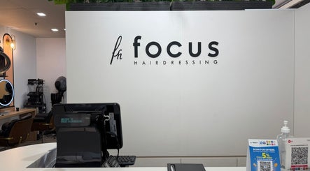 Reception area at Focus Hairdressing in Singapore, SG showcasing modern decor and styling equipment.