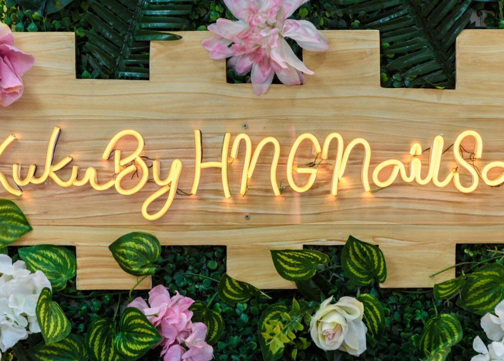 Floral neon sign of KUKU BY HNG BEAUTY SALON in Manila, Metro Manila, PH adds a touch of elegance.