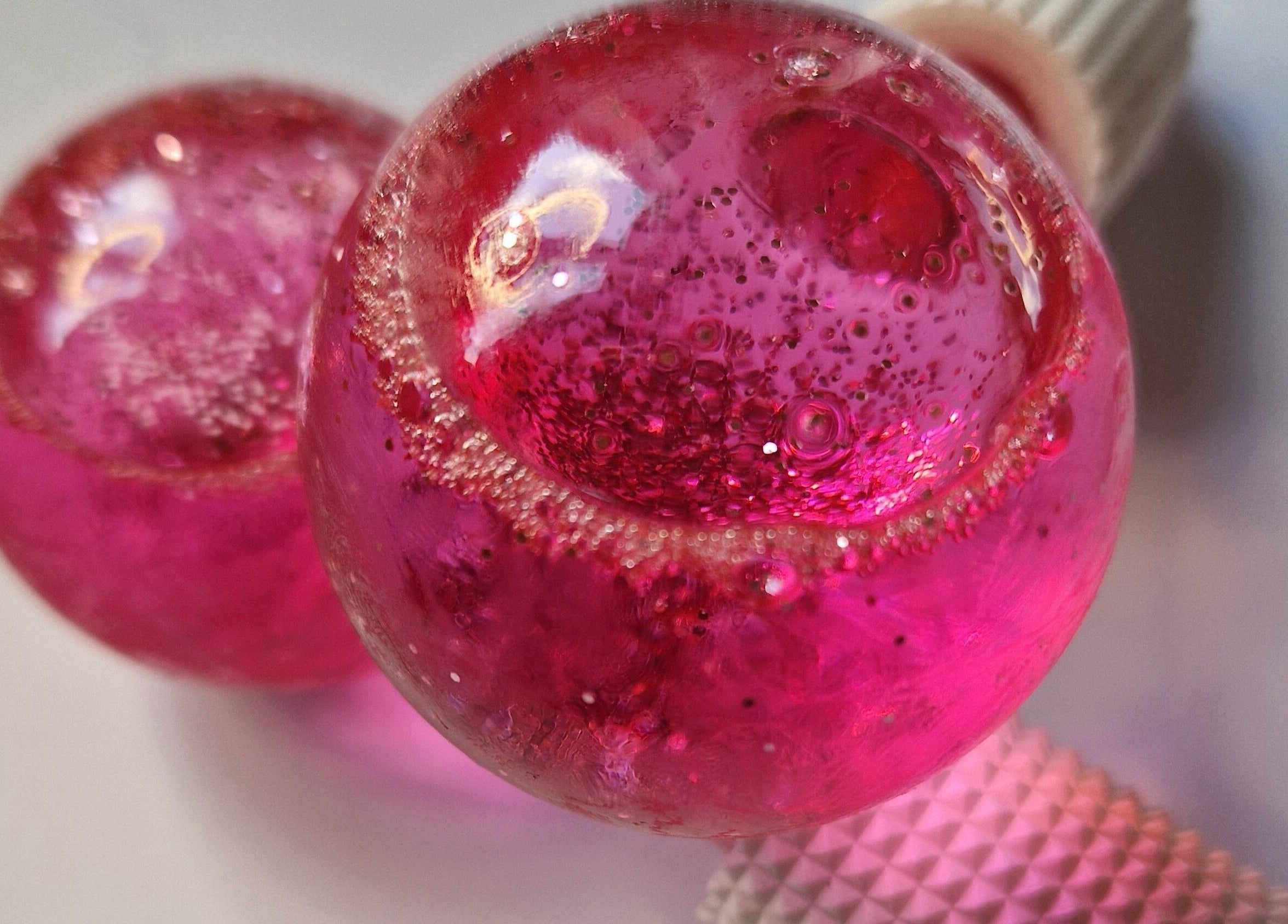Vibrant pink globes at CJB Beauty & Aesthetics, Ashford, England, GB, showcase elegance and artistry.