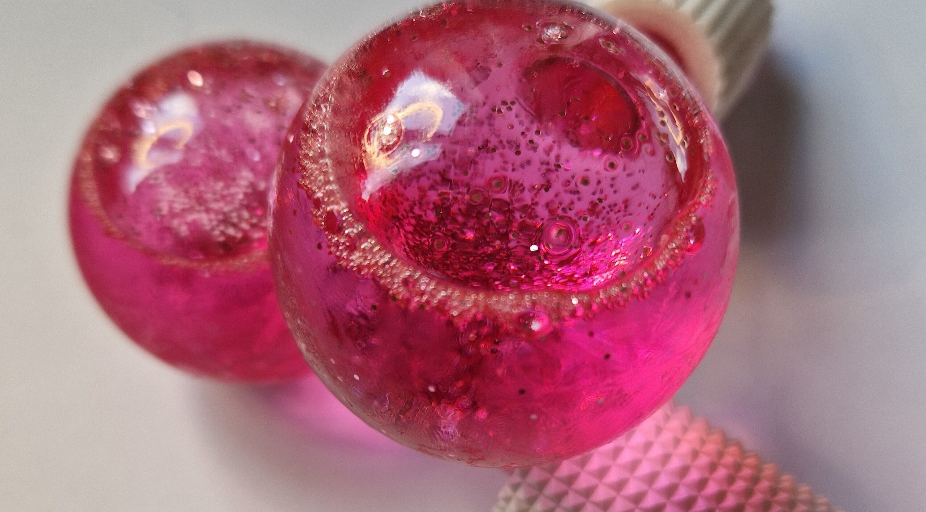 Vibrant pink globes at CJB Beauty & Aesthetics, Ashford, England, GB, showcase elegance and artistry.